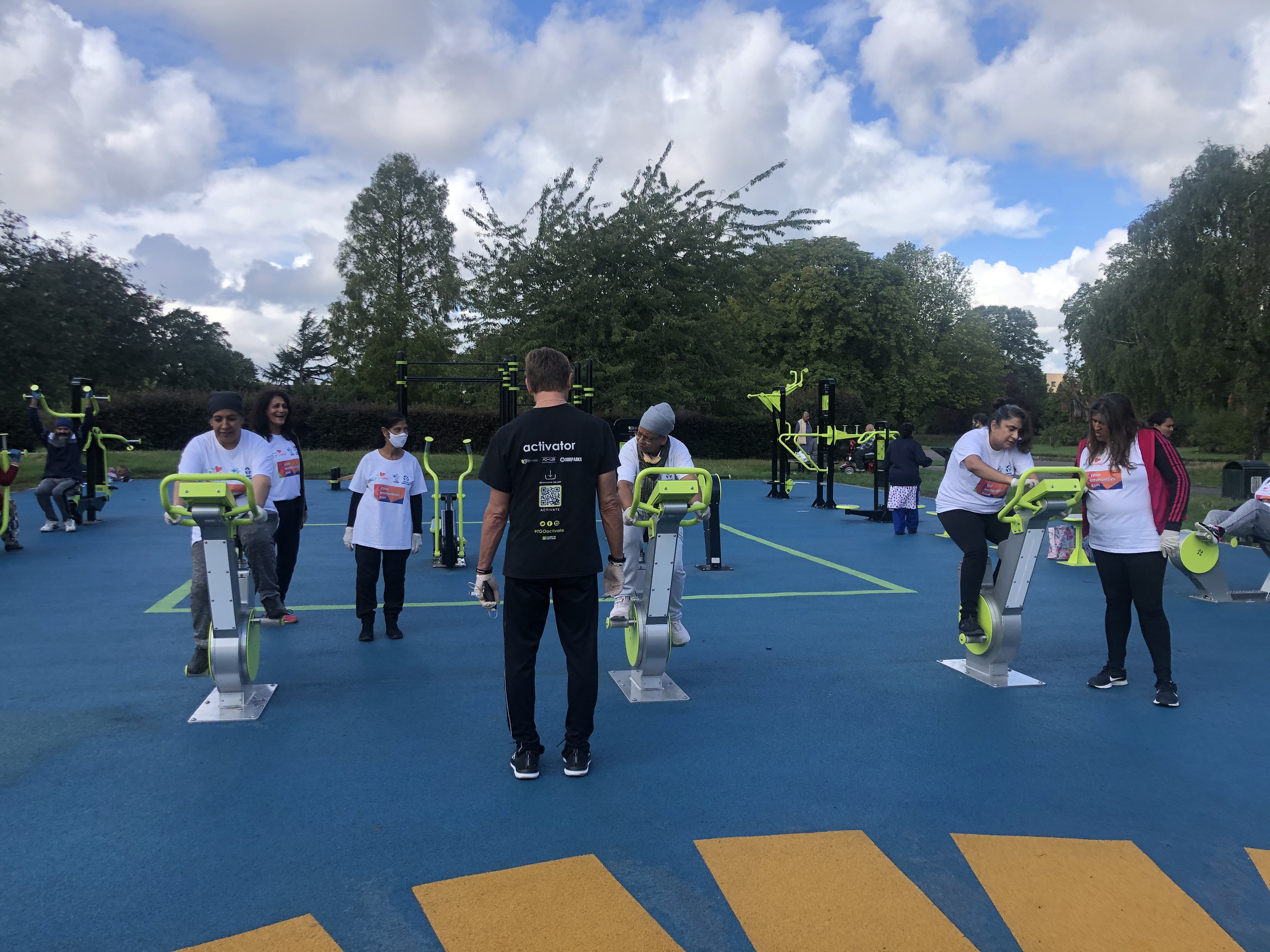 people exercising on an outdoor gym